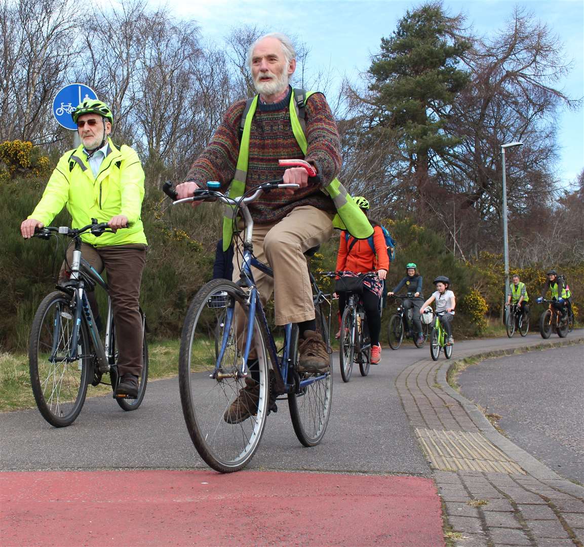 Cyclists on their way to the Knocknagael farm.