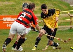 Fort William's Arran MacPhee goes on the attack against Glenurquhart.