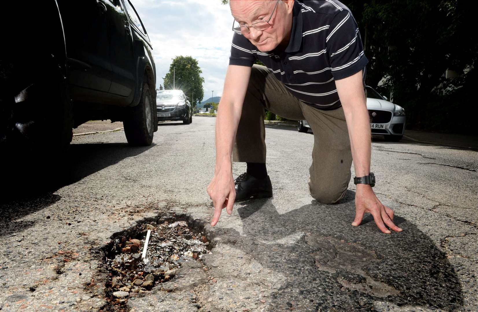 Charles Bannerman potholes from roads and pavements being dug up: Charles Bannerman pointing out a pothole..Picture: James Mackenzie..