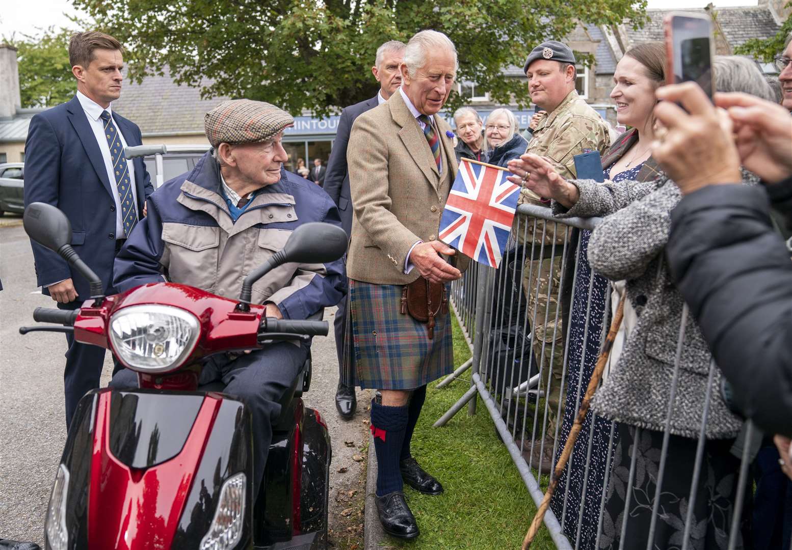 Charles spoke in French to some well-wishers (Jane Barlow/PA)