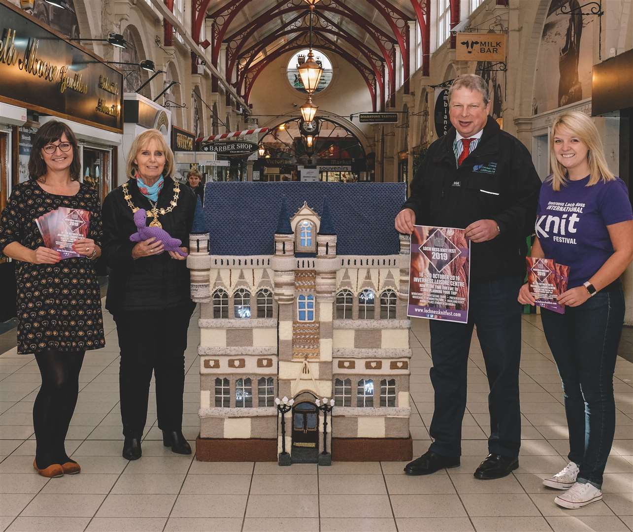 Victorian Market manager Jo Murray, Provost Helen Carmichael, Highland Council’s Inverness city manager David Haas and Loch Ness Knit Fest organiser Cecilia Grigor with the town house in wool.