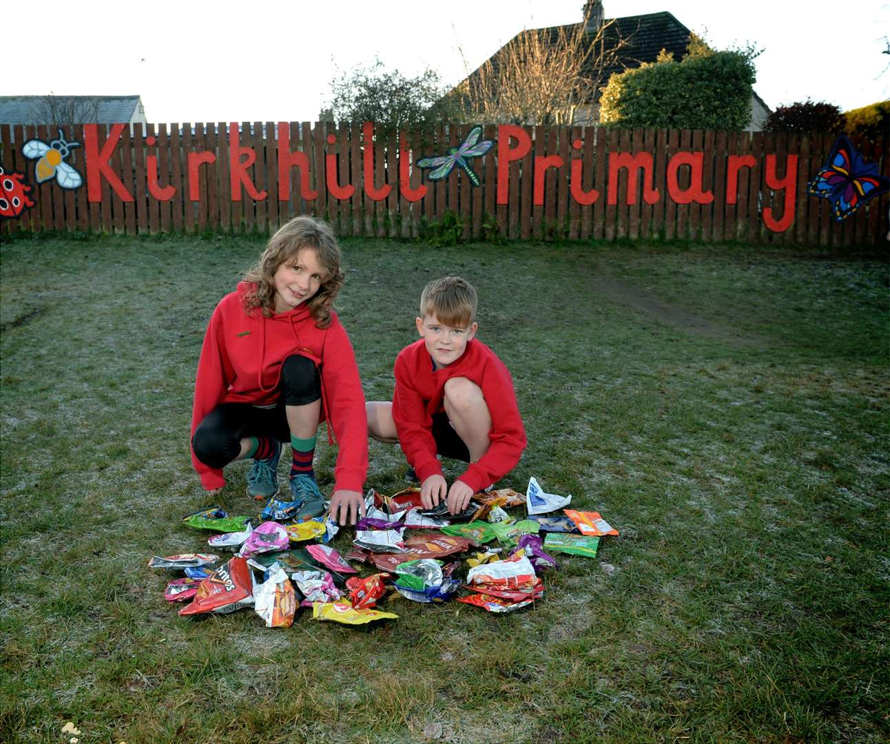 Kirkhill Primary School pupils Annie English and Robbie Stoddart sort out the empty crisp packets.