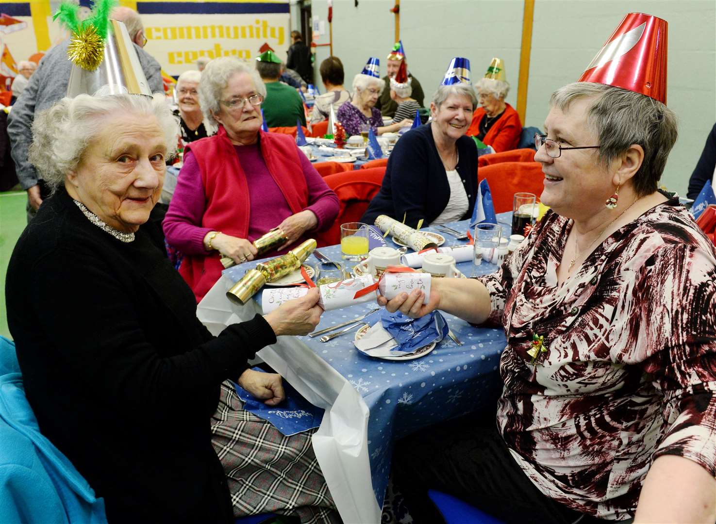 Dalneigh Pensioners Christmas Dinner: Pulling a cracker are Moira MacDonald and Leonora Fraser. Picture: Gary Anthony.