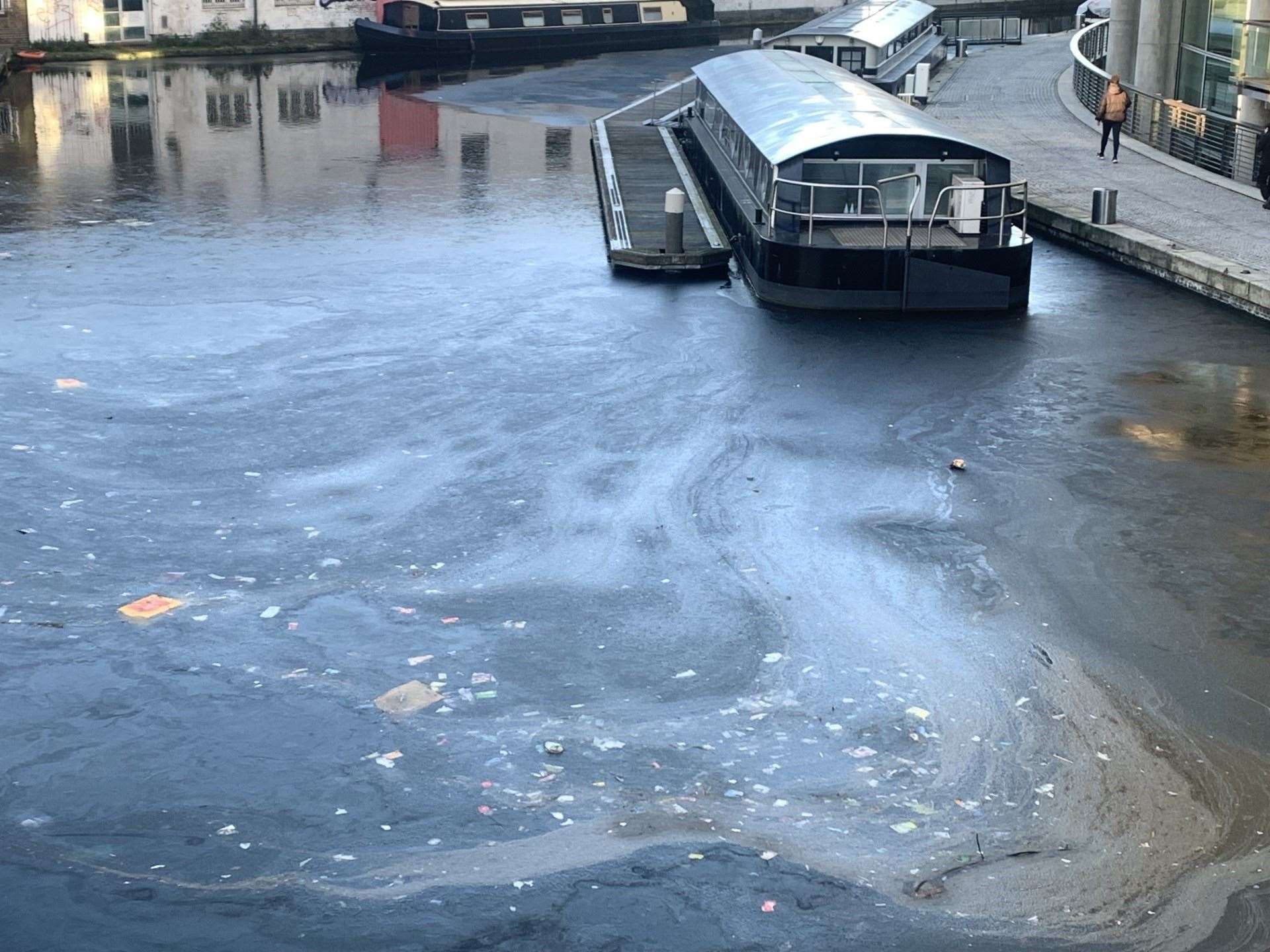 Debris frozen in the Grand Union canal at Paddington Basin in London (Peter Clifton/PA)
