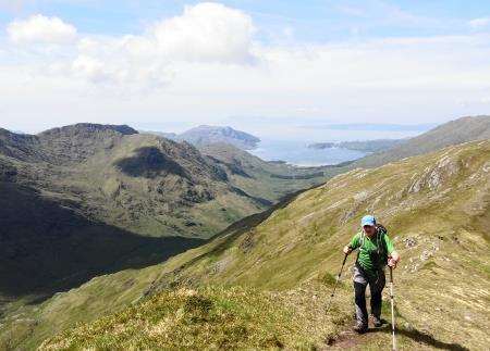 Peter approaching the top of Meall Buidhe looking back over Inverie Bay.