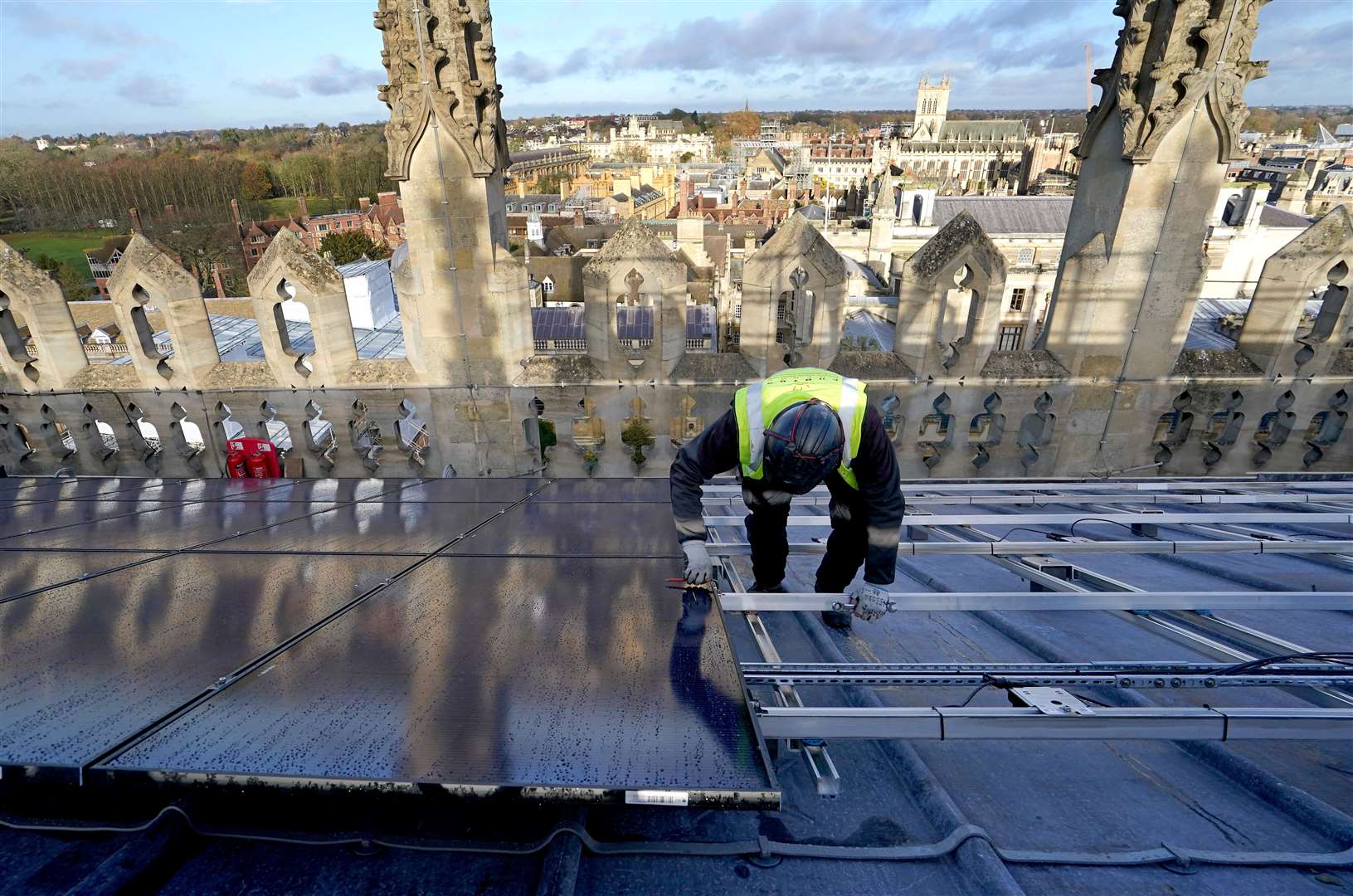 A photovoltaic engineer at work on the installation of 438 new solar panels (Gareth Fuller/ PA)