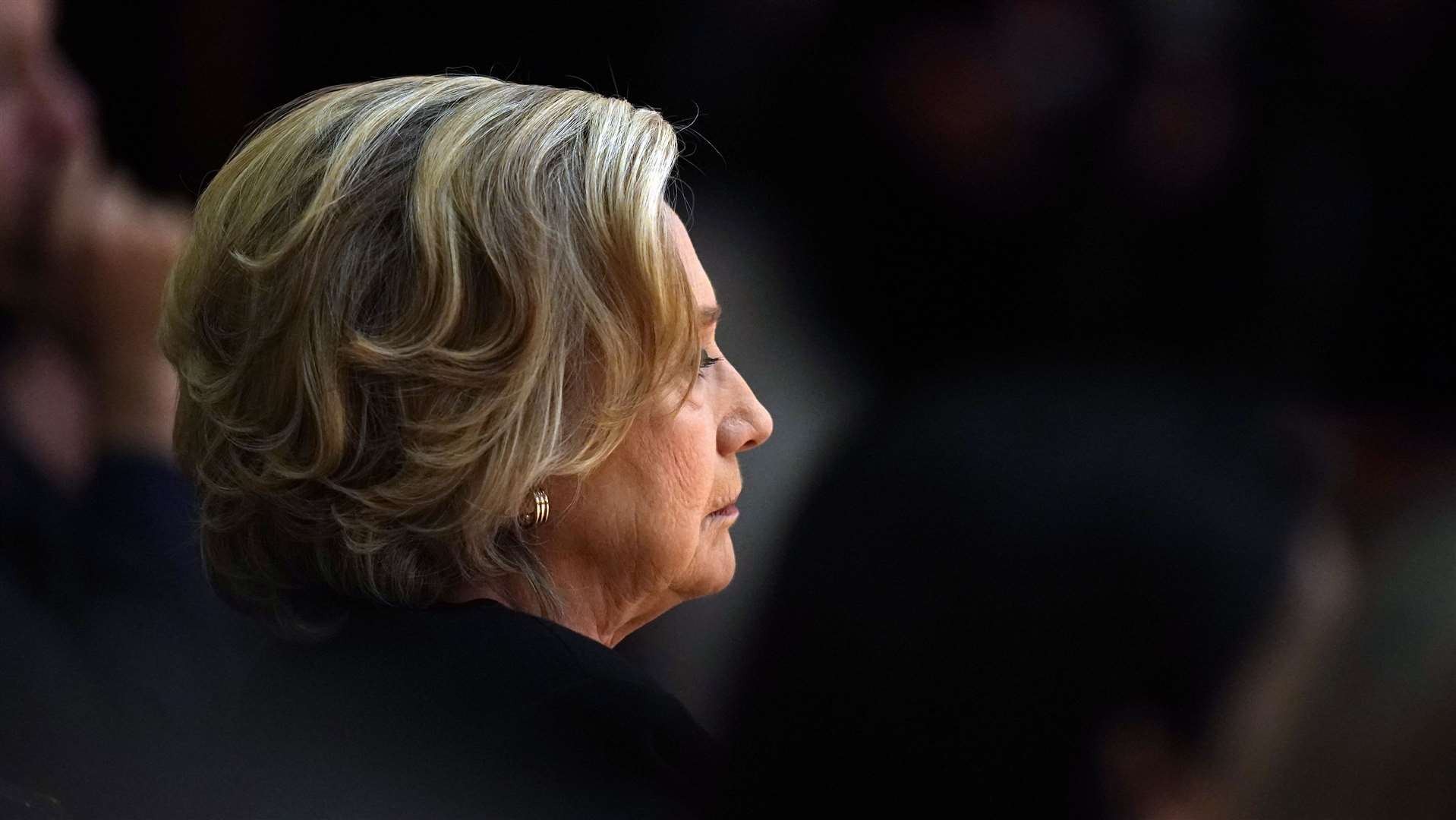 Hillary Clinton listening to speakers during the conference (Niall Carson/PA)