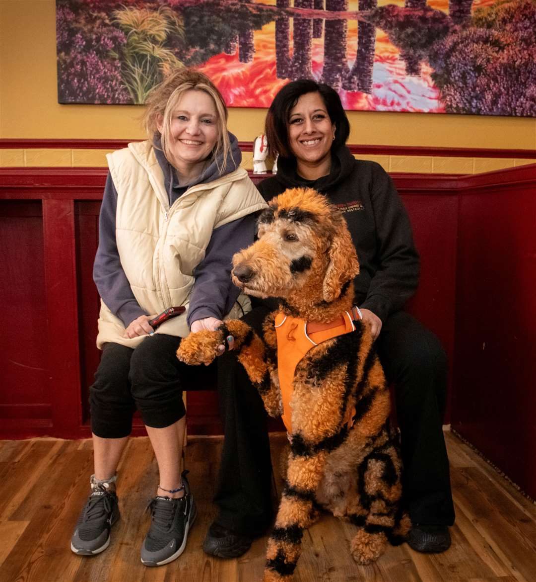 Jax Davies, of Alness dog groomers Short Bark and Sides, Neetu Singh and Luther. Picture: Callum Mackay.