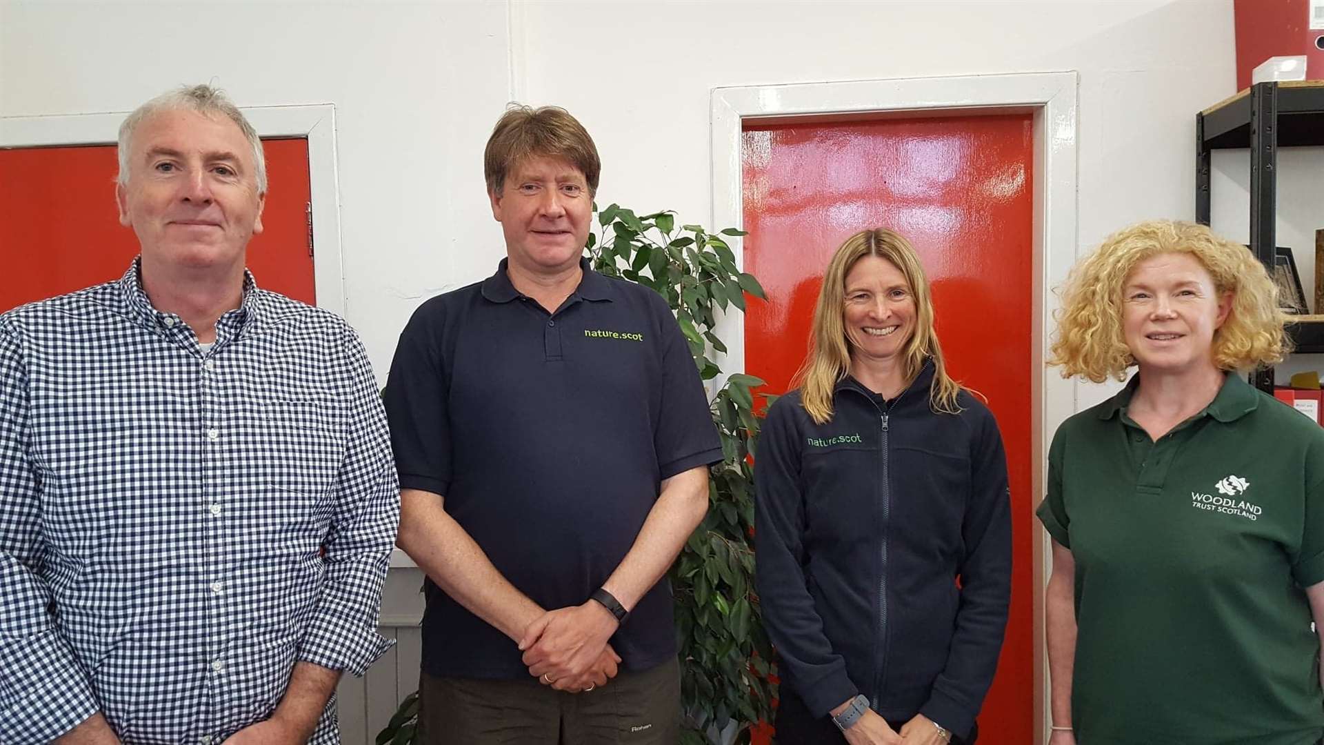 Wind farm developer Calum MacDonald (left) and Western Isles Croft Woodland project officer Viv Halcrow (right) meeting David Maclennan (second left), SNH area manager for Argyll and Outer Hebrides, and Francesca Osowska, SNH chief executive, in the offices of Point and Sandwick Trust.