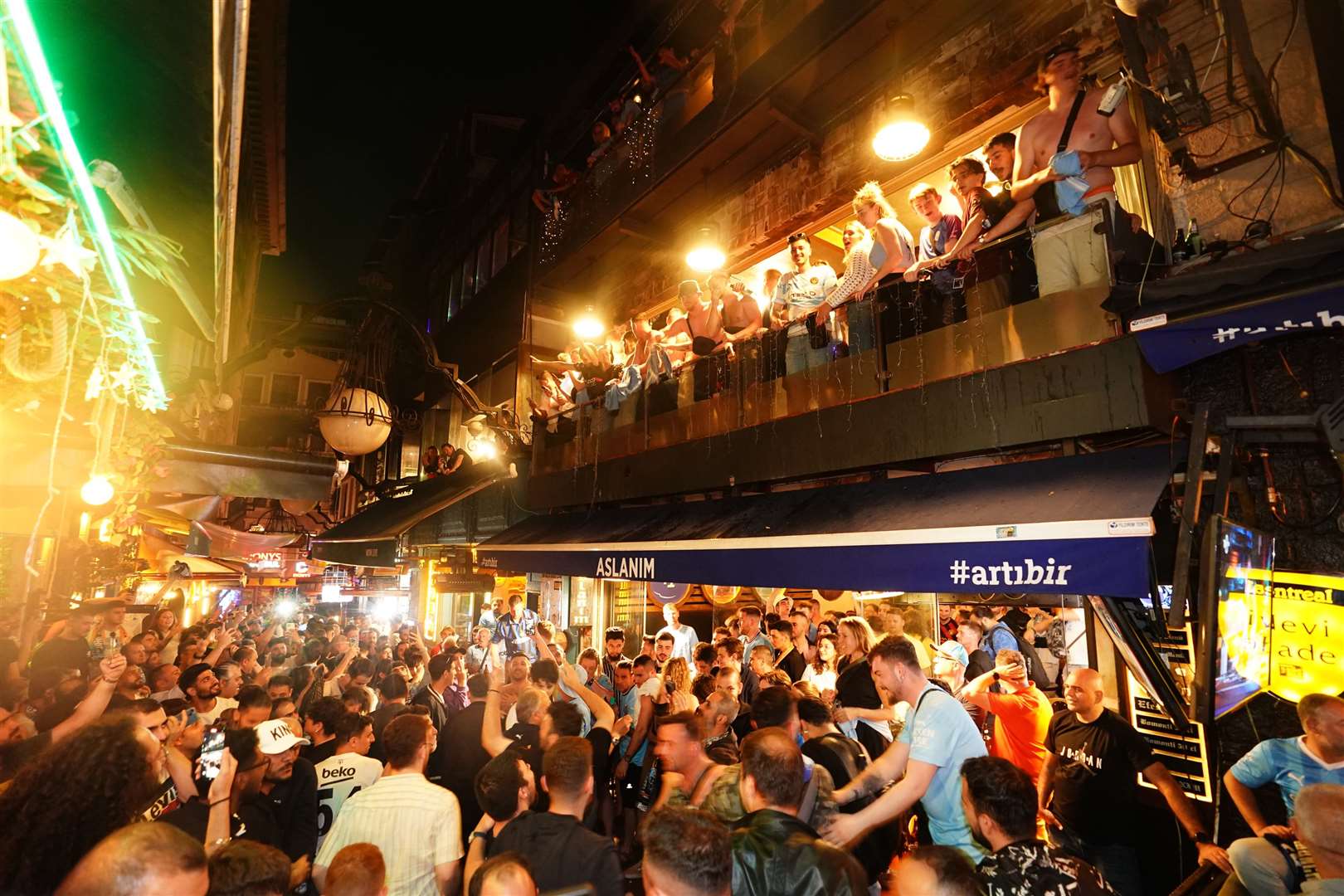Man City fans celebrate their team’s victory in central Istanbul (James Manning/PA)