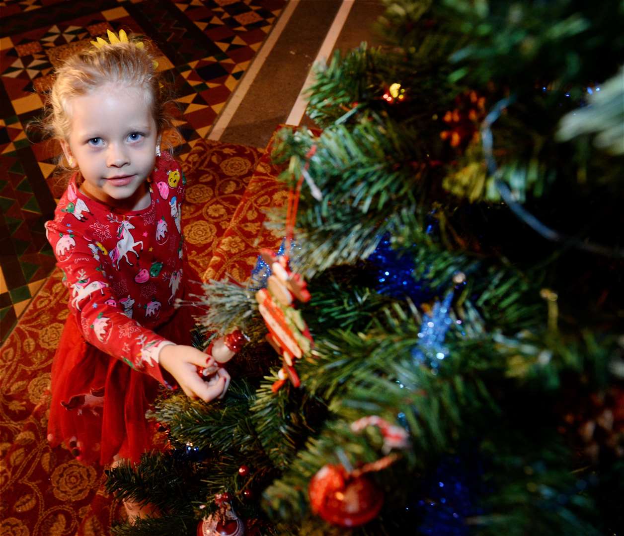 Eila Miller (4) helps with the Christmas tree for the video. Picture: Gary Anthony.