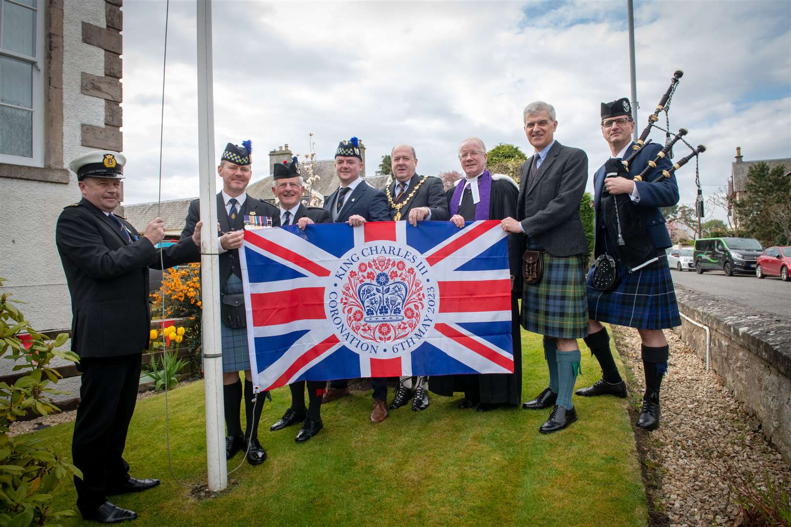 Neil Simpson, Chief Petty Officer Merchant Navy; Dale Woodman, Nairn Royal British Legion (RBL) chairman; Lieutenant Colonel Bob Towns, John Brooks, RBL area chairman; Provost Laurie Fraser; Rev Tommy Bryson; Vice Lord Lieutenant Scott Gordon and Kevin Reid, Pipe Major with the Nairn Pipe Band at a special flag raising. Picture: Callum Mackay