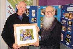 Ray Collier (right) makes the presentation to Jimmy McKellar.