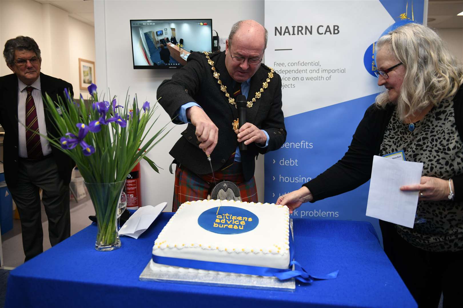 Provost Laurie Fraser cutting the cake at the official opening. Picture: James Mackenzie