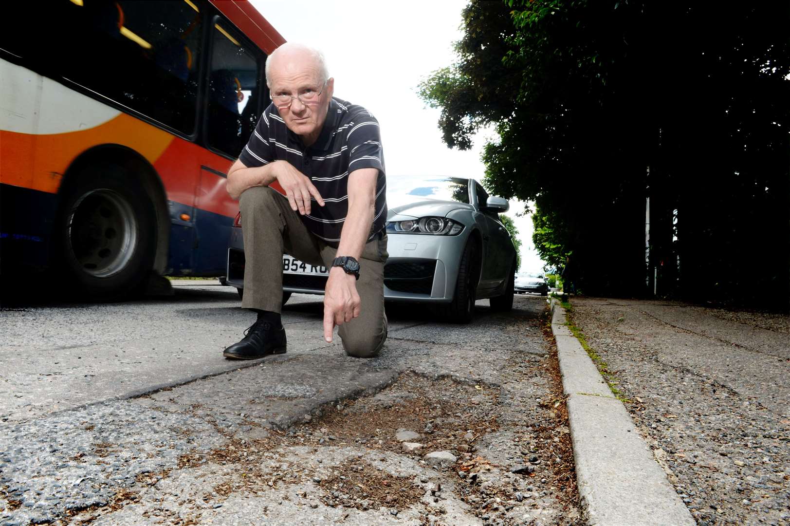 Charles Bannerman potholes from roads and pavements being dug up: Charles Bannerman pointing out a pothole..Picture: James Mackenzie..