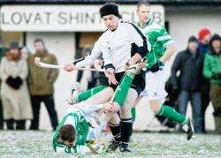 Lovat's Euan Ferguson sends a Beauly player tumbling in their Lovat Cup clash