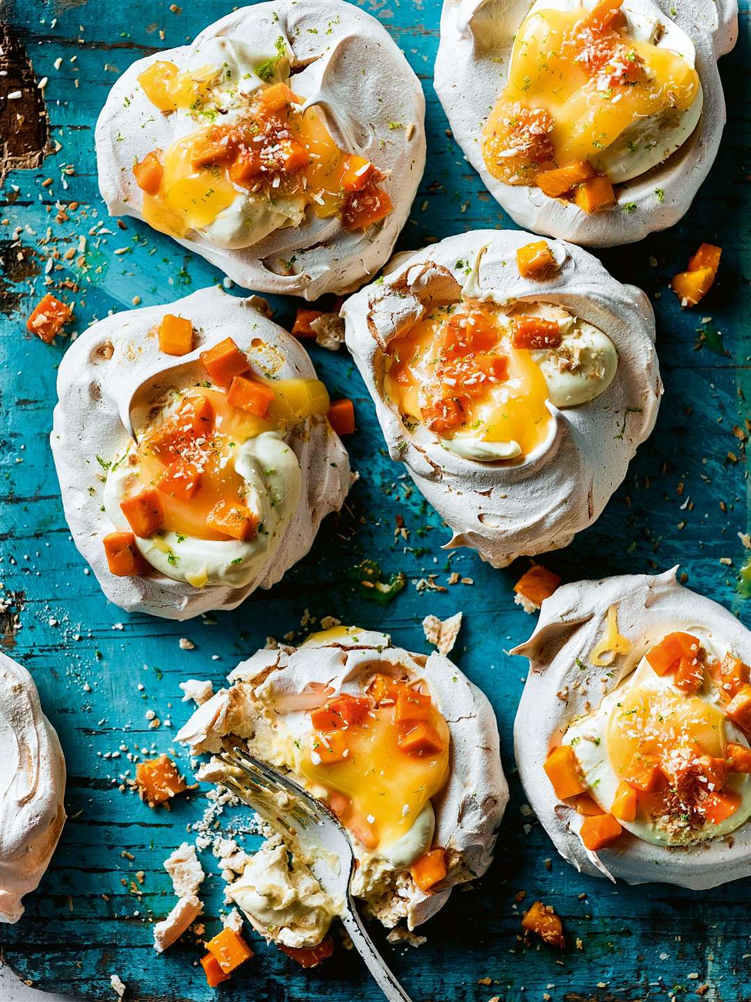 Mango, lime and coconut meringue recipe from The Rangoon Sisters: Recipes From Our Burmese Family Kitchen by Emily and Amy Chung. Picture: Martin Poole/PA