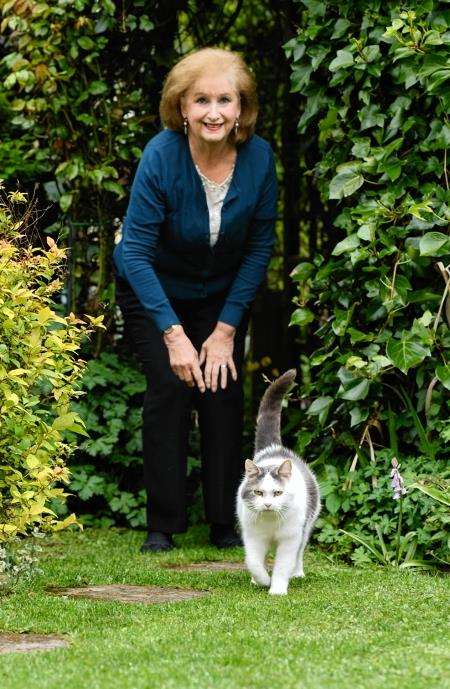 Yvonne Callaghan with her cat Robbie who scared off a rat in their garden