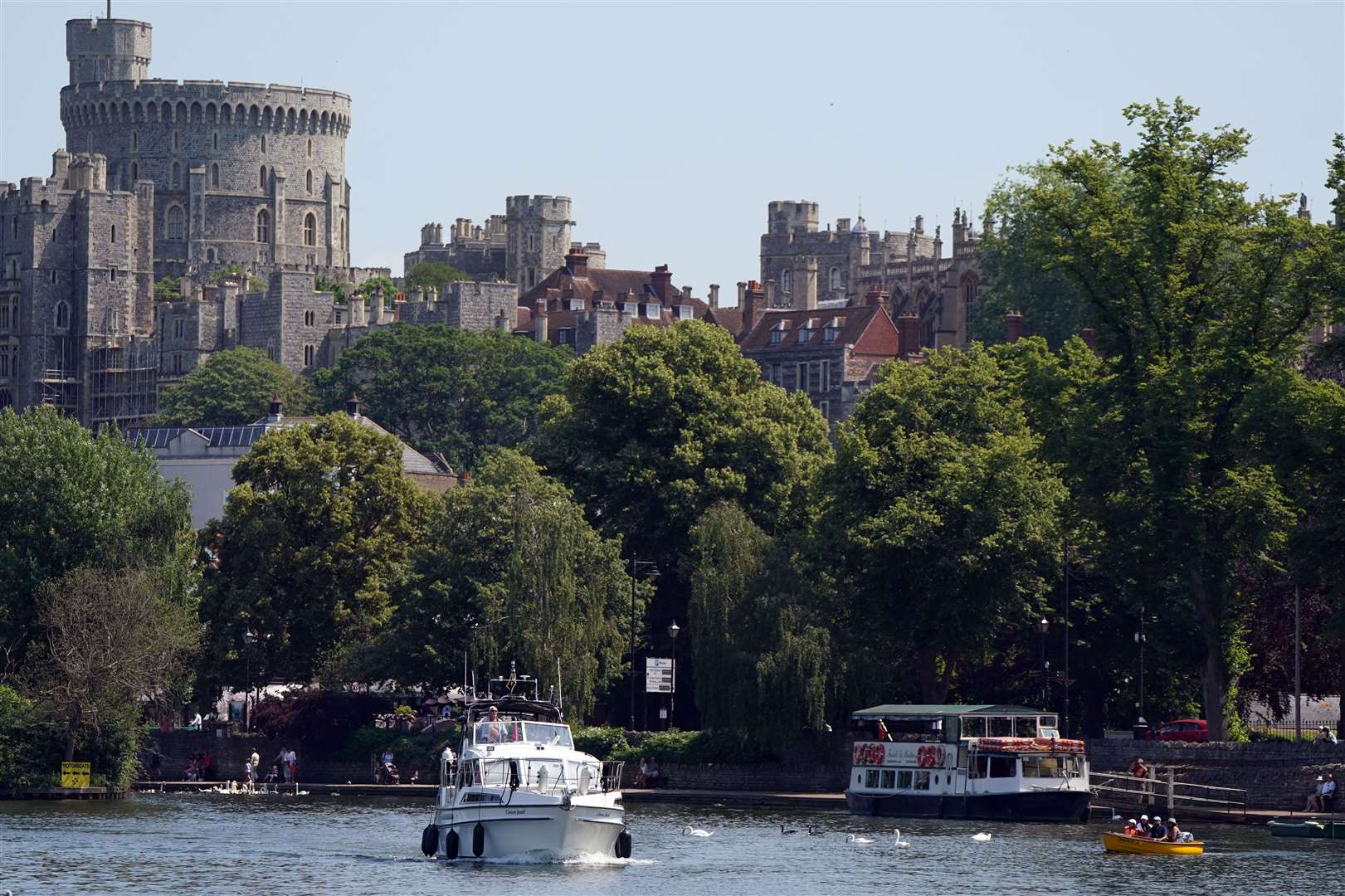 People in boats on the River Thames in Windsor (PA)