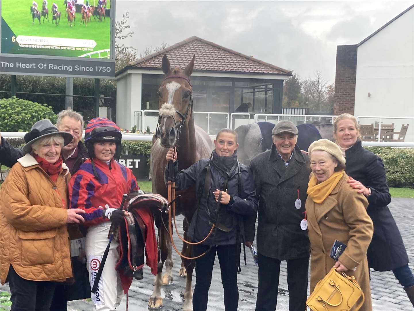 Celebrations for jockey Olive Nicholls, her mother and trainer Georgie Nicholls (far right) and the team after Thank You Ma’am’s third place at Kempton (Fiona Browne/PA)