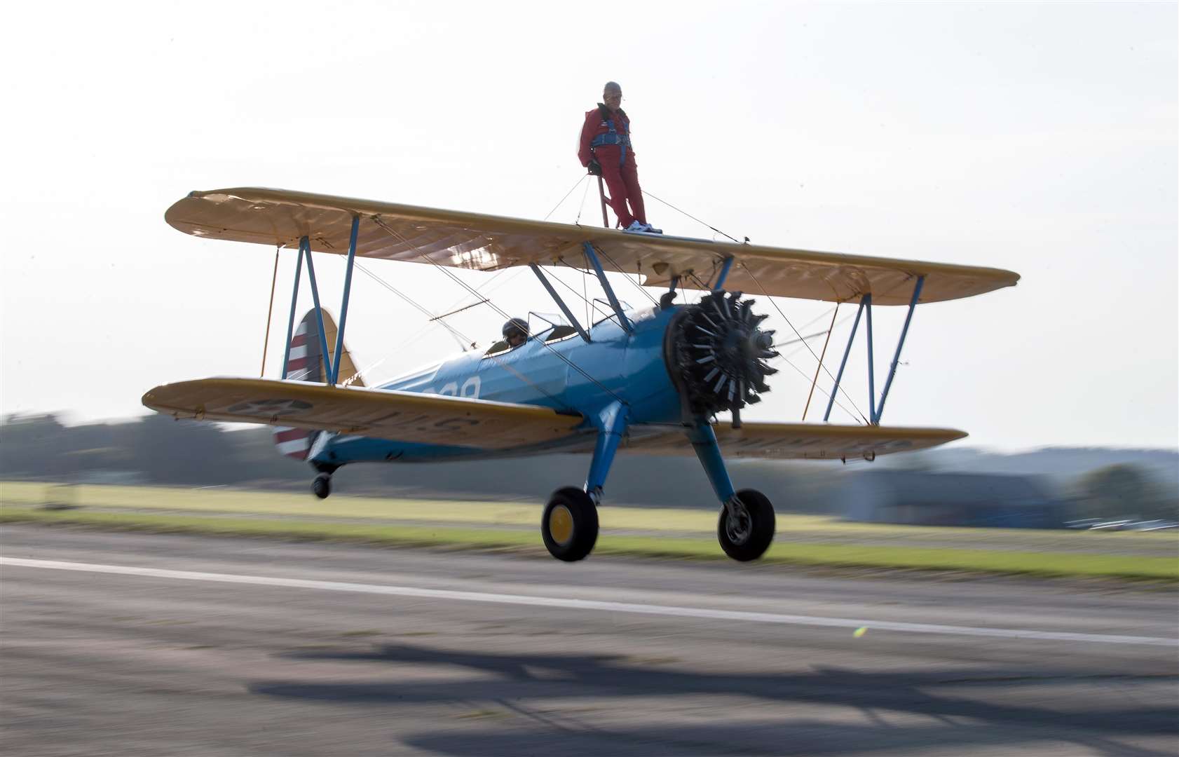 89-year-old John Wilkins takes off on his sponsored wing walk for Bristol Children’s Hospital’s The Grand Appeal at Dunkeswell Airfield near Honiton in Devon (Andrew Matthews/PA)