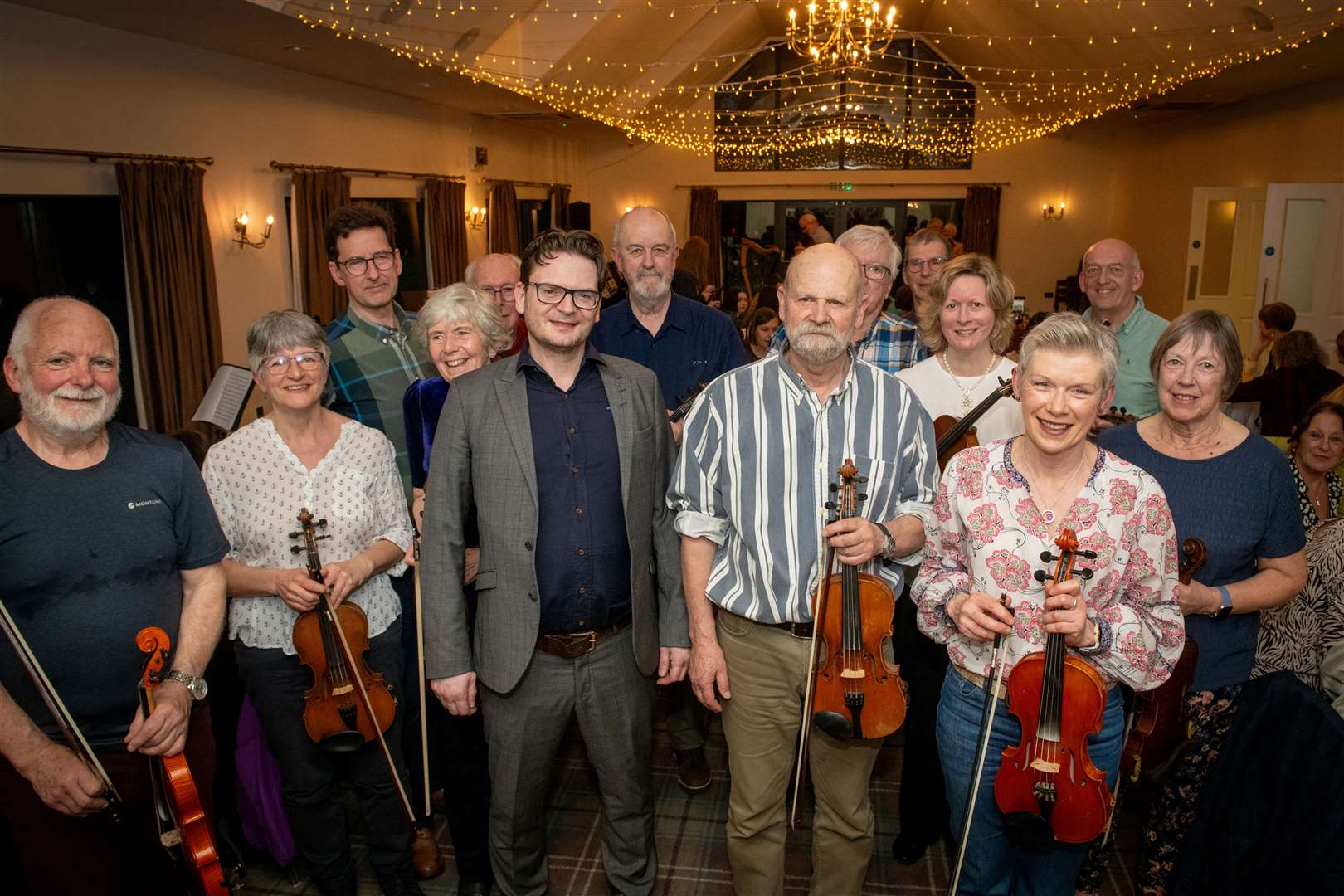 Craig Watson with some of the fiddle players. Picture: Callum Mackay.