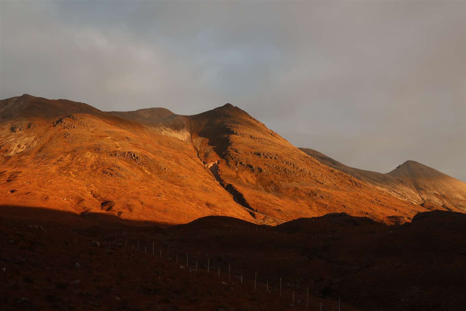 Looking up to Spidean Coire nan Clach on the Beinn Eighe ridge in the early morning sunlight.