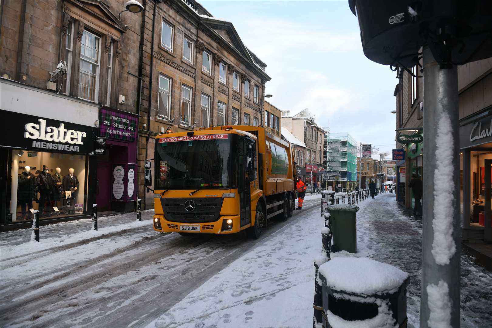 Bin lorry on the High Street in the snow. Picture: James Mackenzie