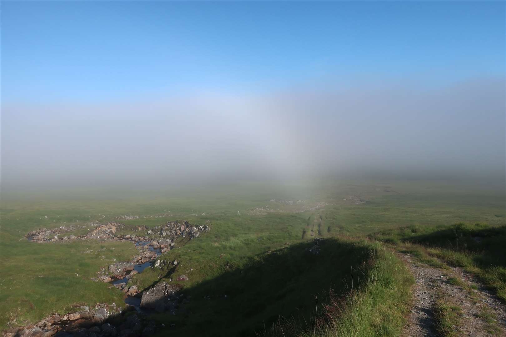 A fogbow can be seen looking back down the track in the morning.