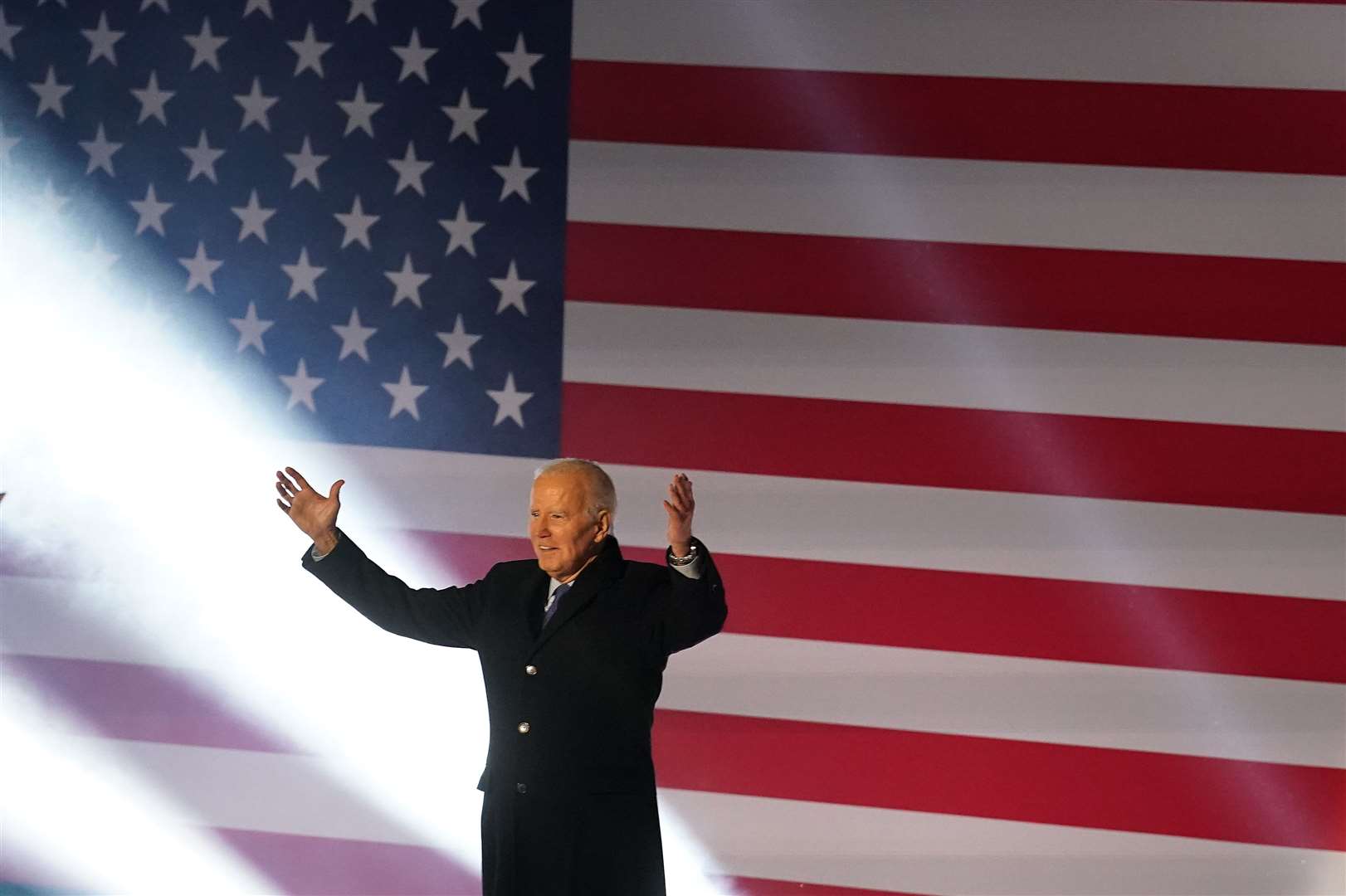 US President Joe Biden arrives on stage to deliver a speech at St Muredach’s Cathedral in Ballina (Brian Lawless/PA)