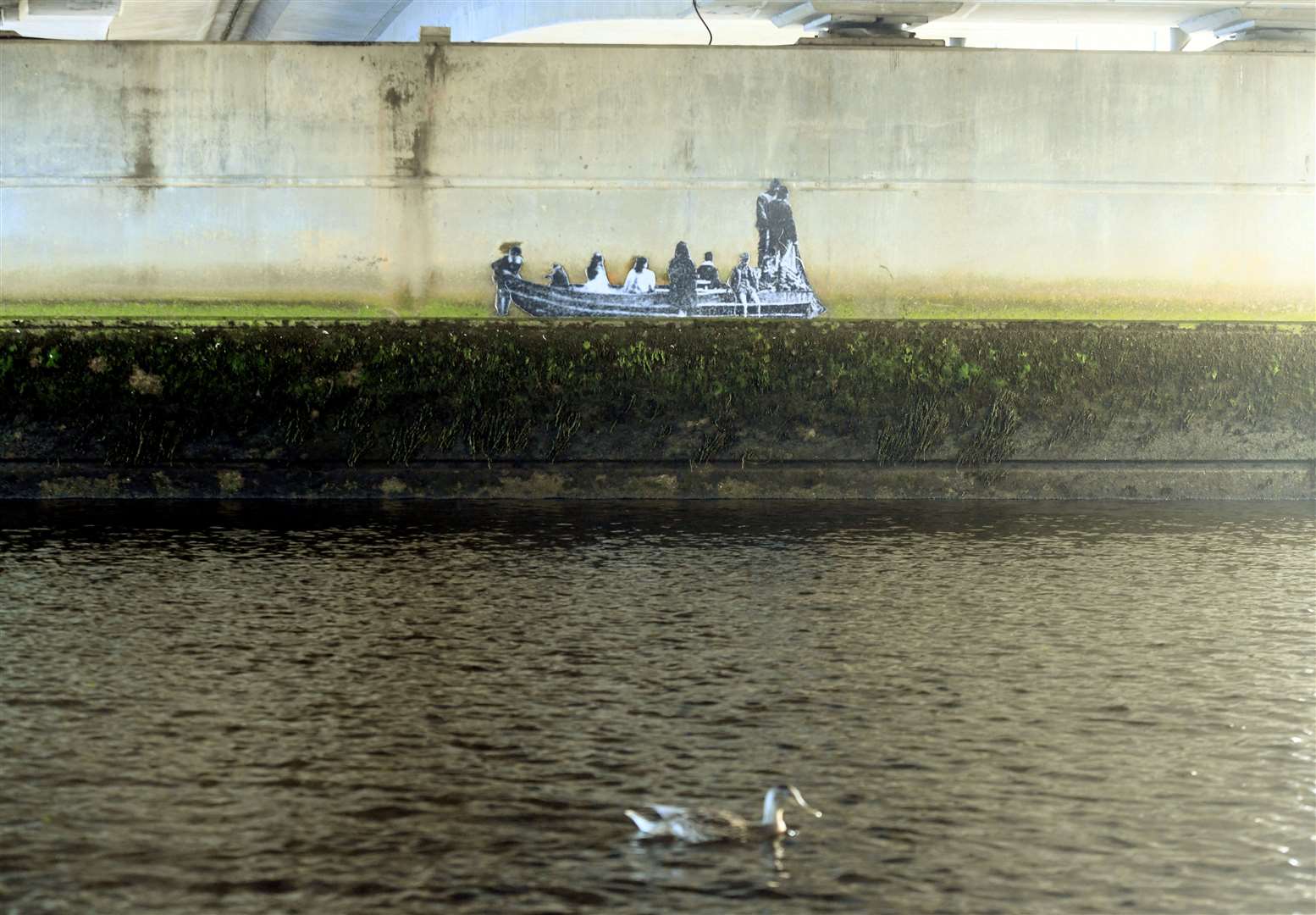 Sticker of people on a boat under Friar's Bridge. Picture: James Mackenzie.