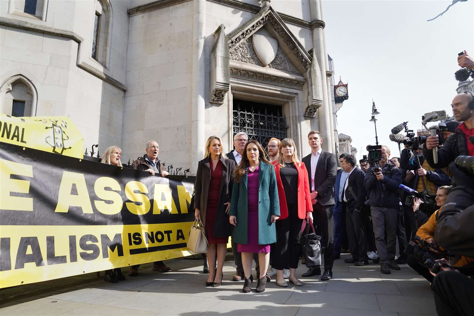 Stella Assange, the wife of Julian Assange, (centre) outside the Royal Courts of Justice in London (Stefan Rousseau/PA)