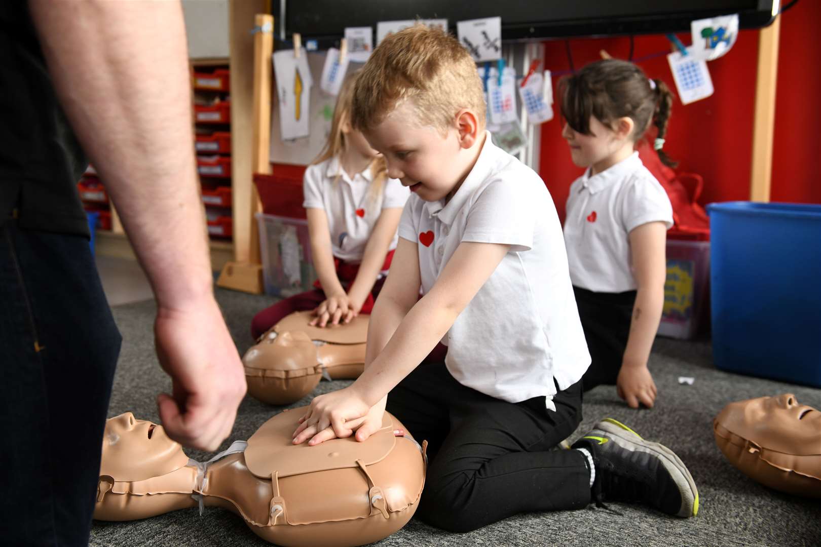 Calum practicing on one of the dummies Highland Training Group brought in to Dalneigh Primary School. Picture: James Mackenzie.