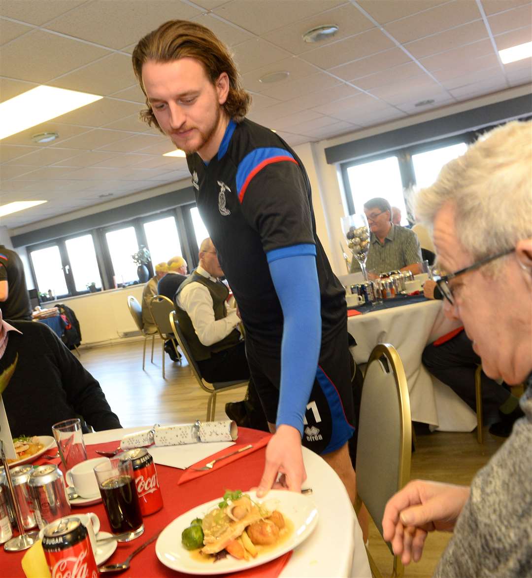 Inverness Caledonian Thistle hold a Festive Friends Christmas meal. Tom Walsh helps out with serving the meals. Picture: Gary Anthony.