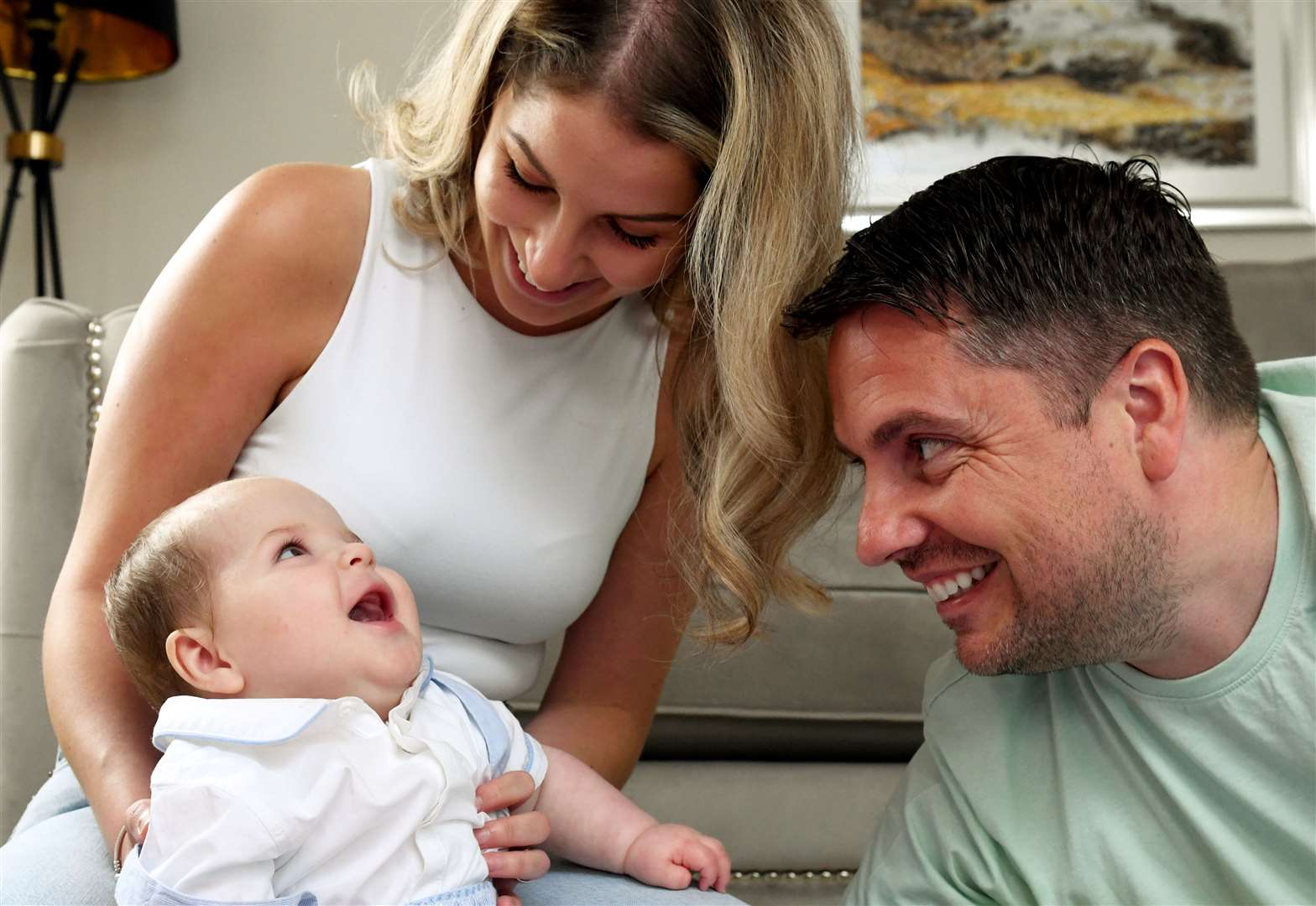Harrison, with parents Catherine and David MacLean, who had life-saving surgery. Picture: James Mackenzie.