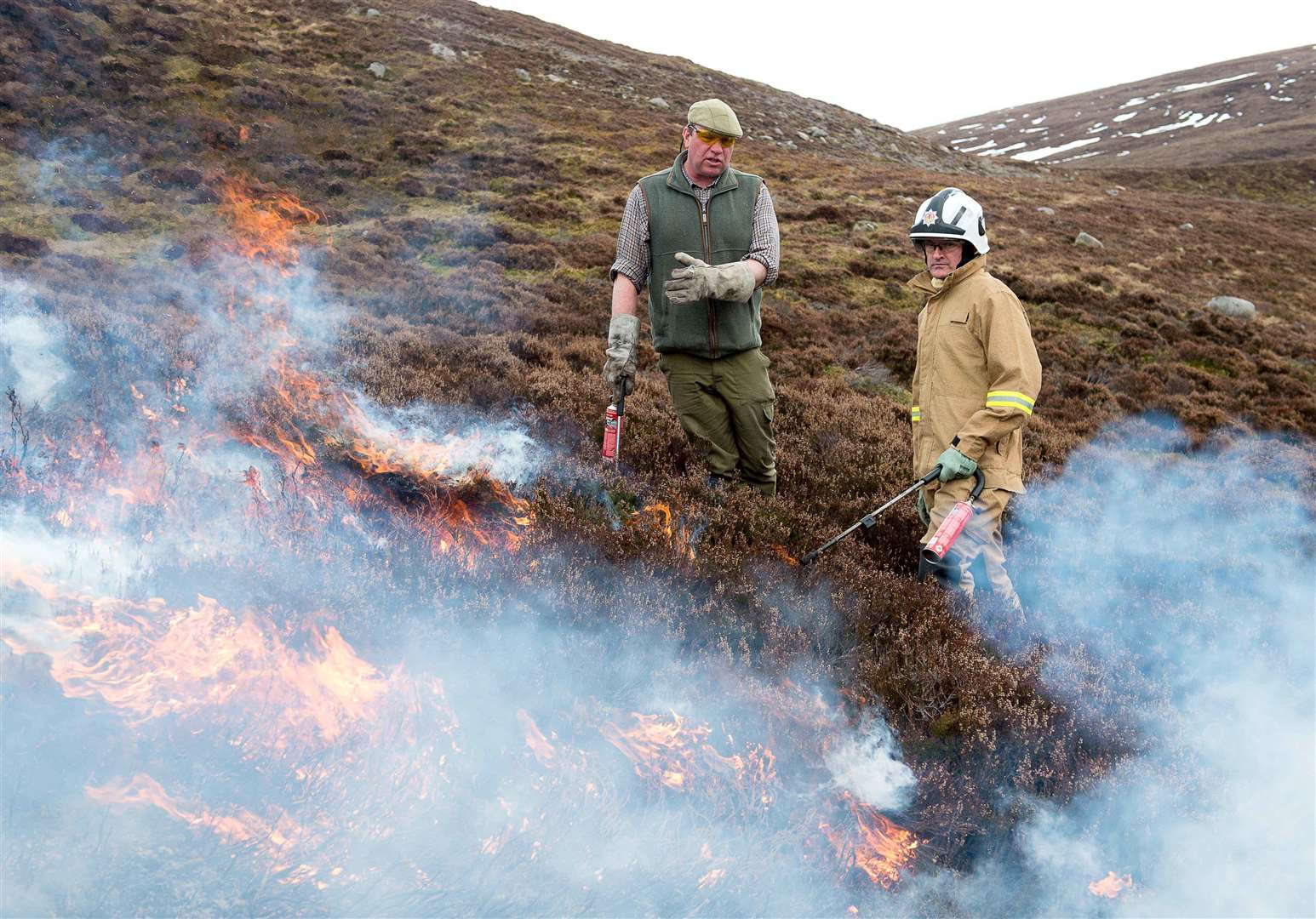 Dunmaglass Estate head keeper Iain Hepburn and station officer Alex McKinley of the Scottish Fire and Rescue Service.