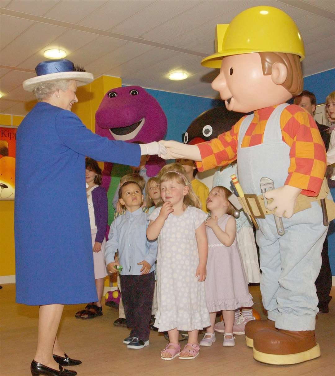 The Queen is greeted by children’s character Bob the Builder in 2004 (Fiona Hanson/PA)