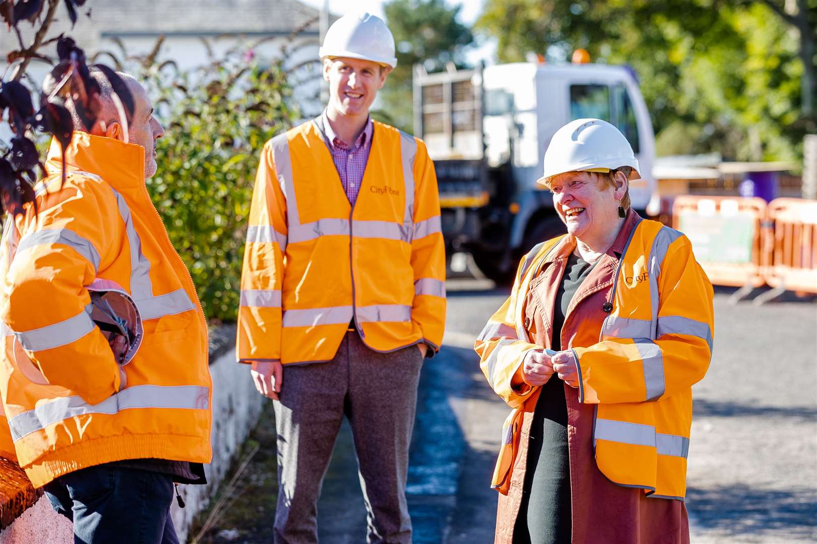 Allan McEwan (centre), Inverness city manager at CityFibre, shows Highland Council leader Councillor Margaret Davidson, some of the progess being made. Photograph: Paul Campbell