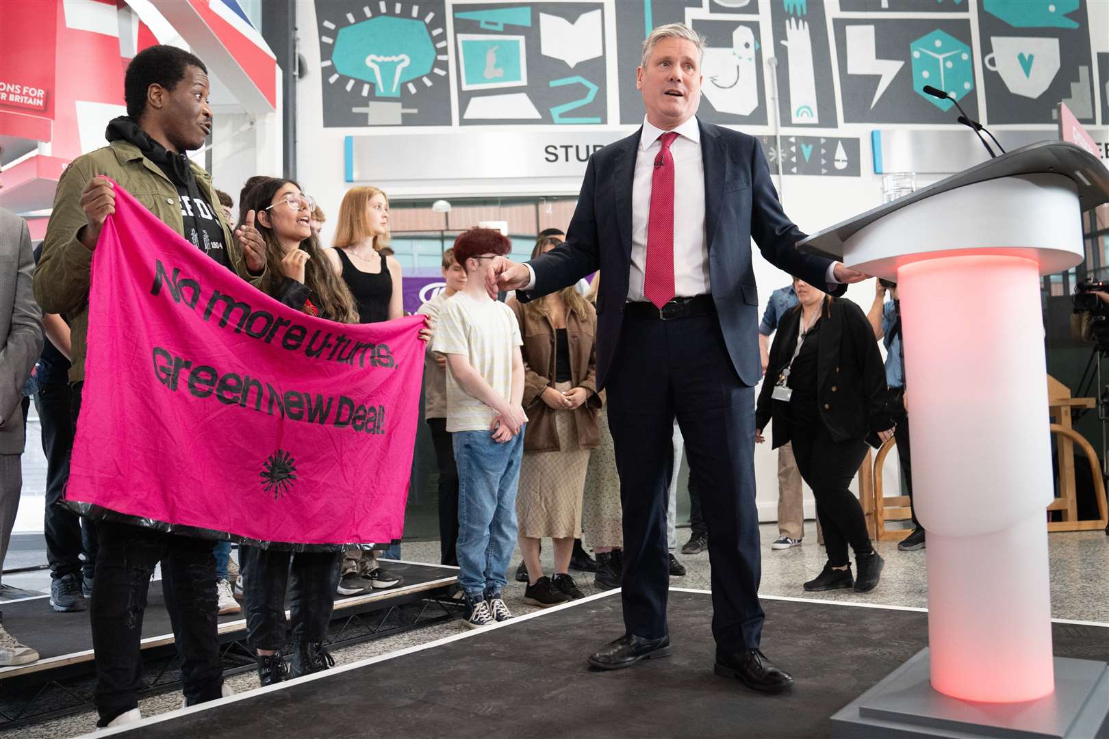 Demonstrators interrupt Sir Keir Starmer during the launch of the party’s plan to break down barriers to opportunity (Stefan Rousseau/PA)
