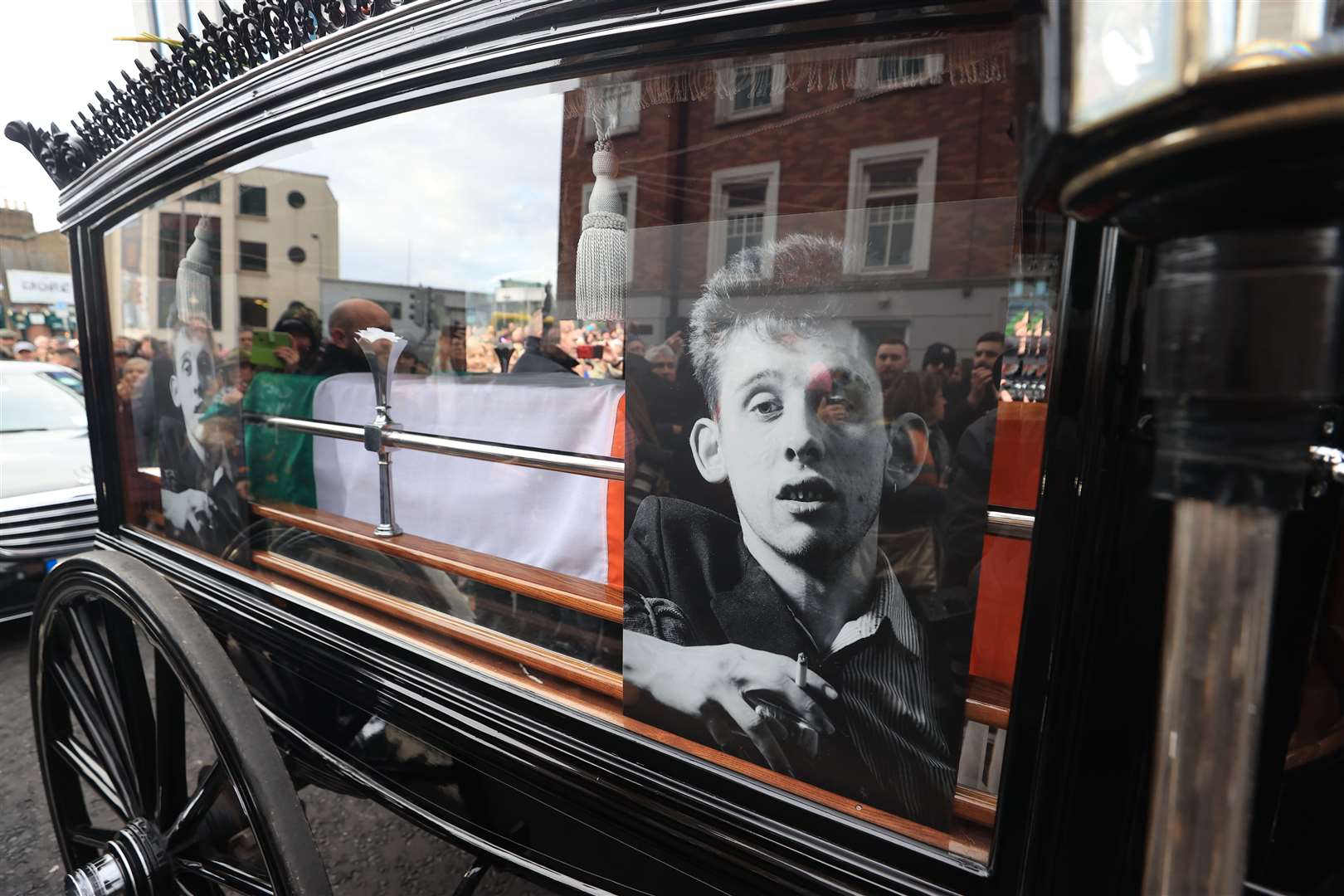 The funeral procession of Shane MacGowan makes its way through the streets of Dublin (Liam McBurney/PA) 