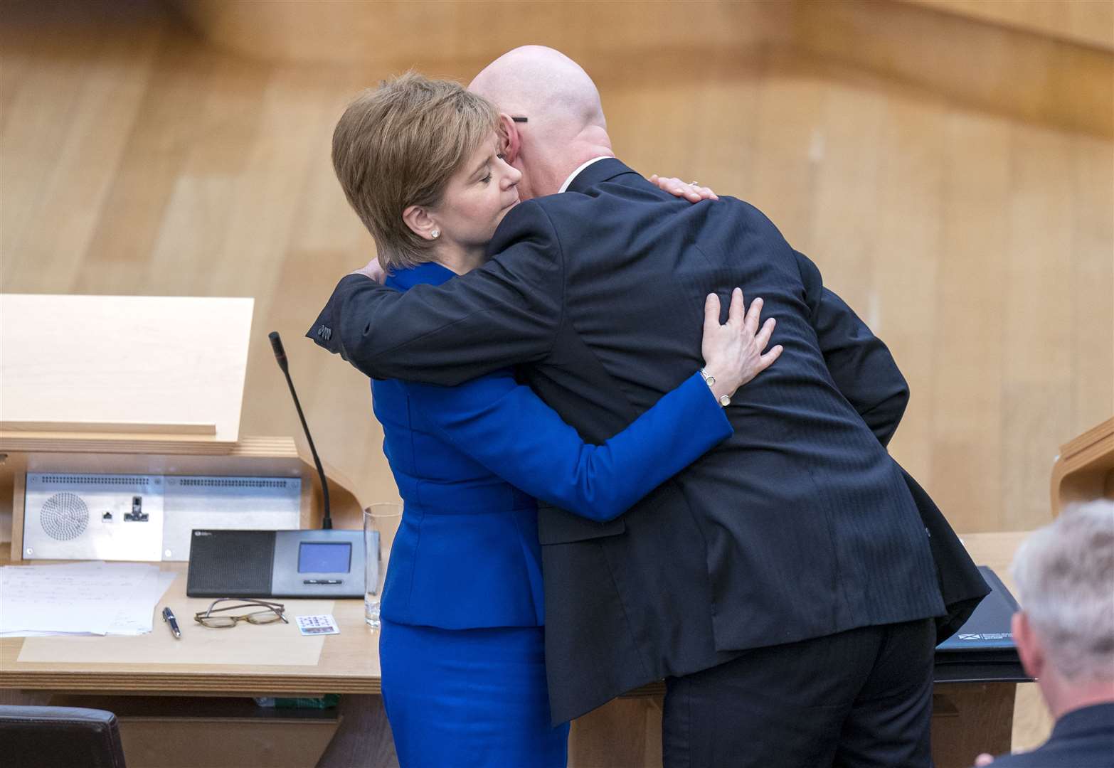 Nicola Sturgeon and John Swinney embraced at the end of her final session of First Minister’s Questions on Thursday (Jane Barlow/PA)