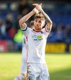 Greg Tansey salutes the away support after the Highland derby. Picture: Ken Macpherson.