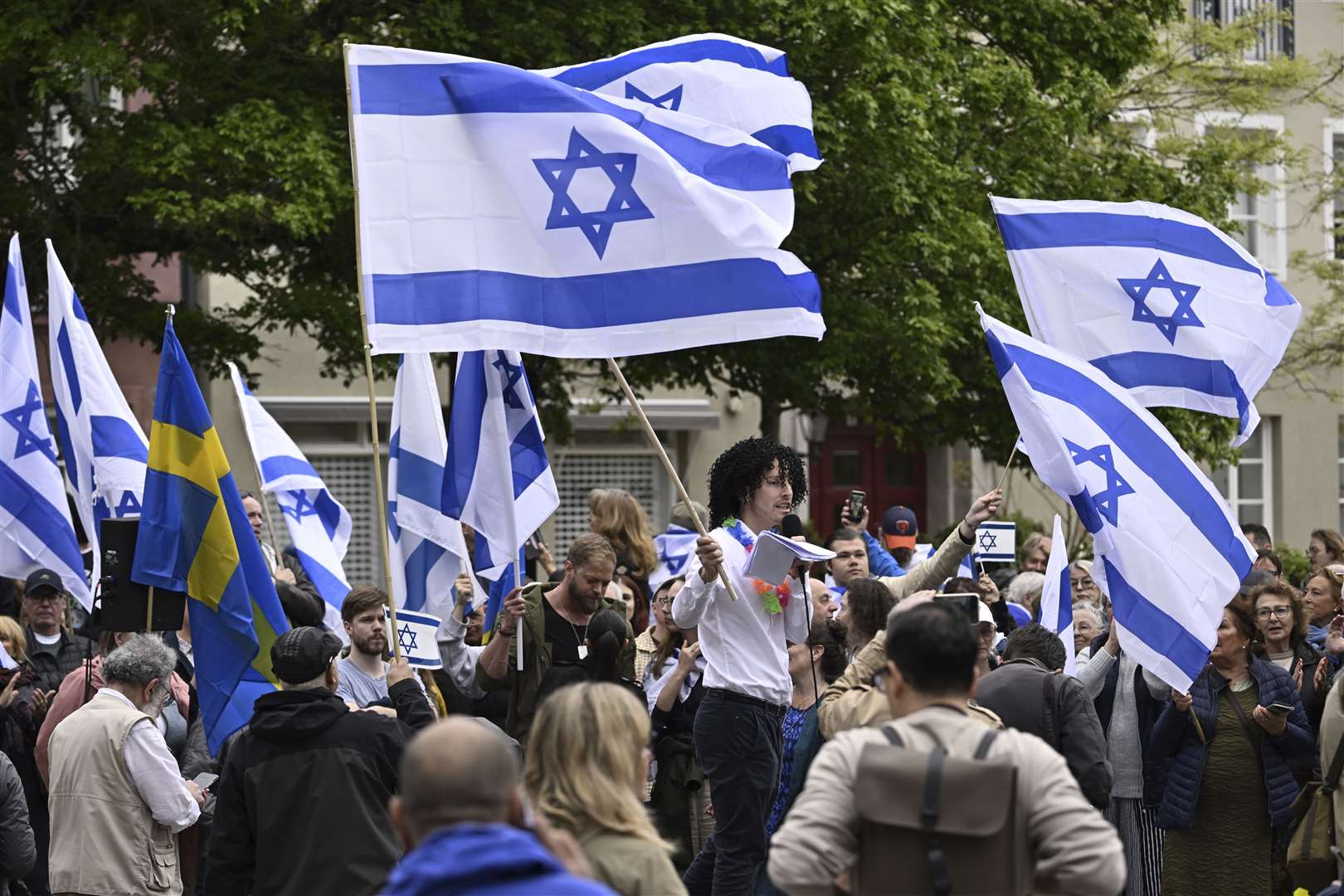 People carry Israeli and Swedish flags during a pro-Israel demonstration to pay tribute to Israel’s Eurovision participant Eden Golan in Malmo, Sweden (Johan Nilsson/TT News Agency via AP)
