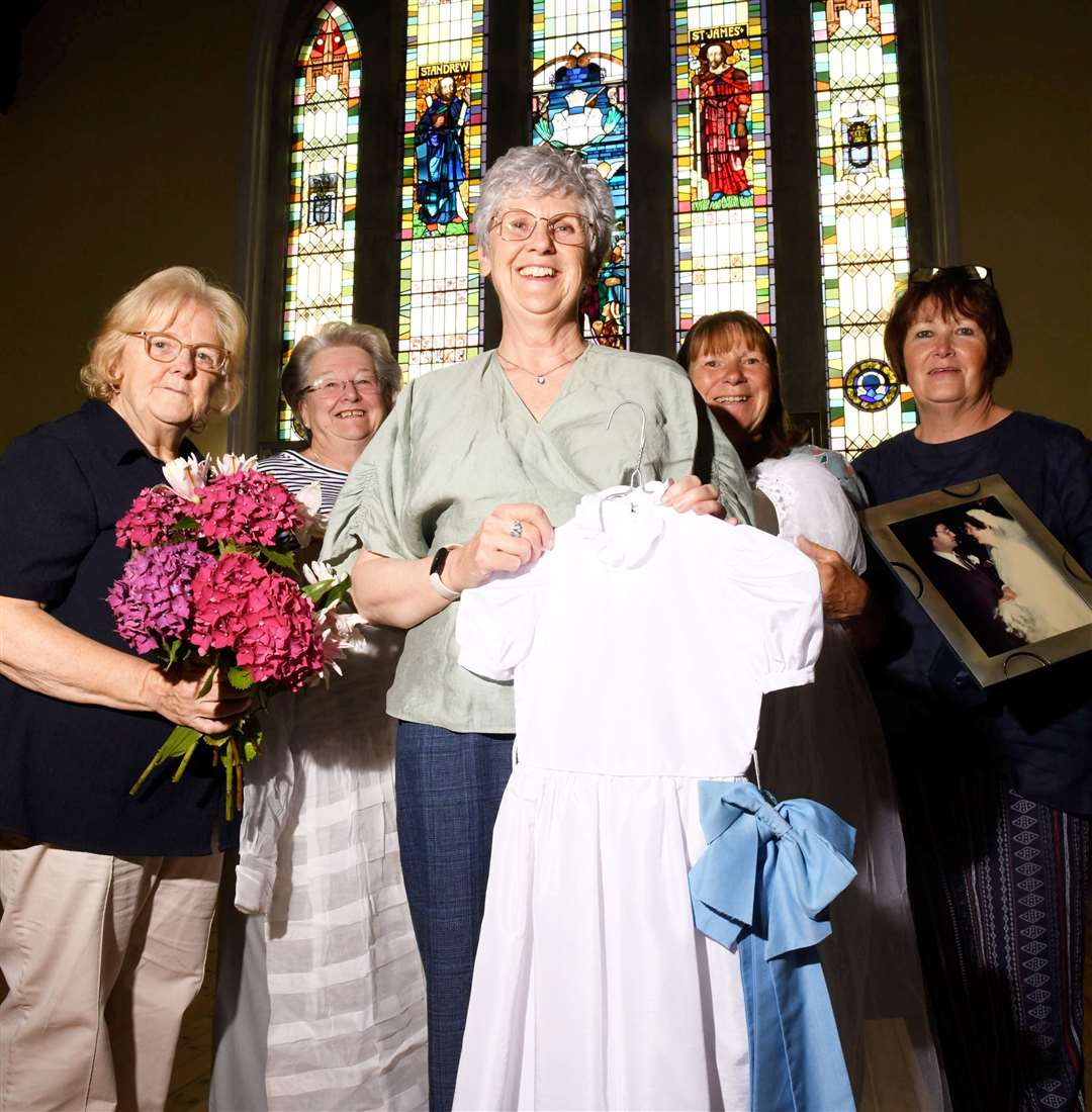Lesley McRoberts (middle) and other volunteers set up the wedding exhibition. Picture: James Mackenzie.