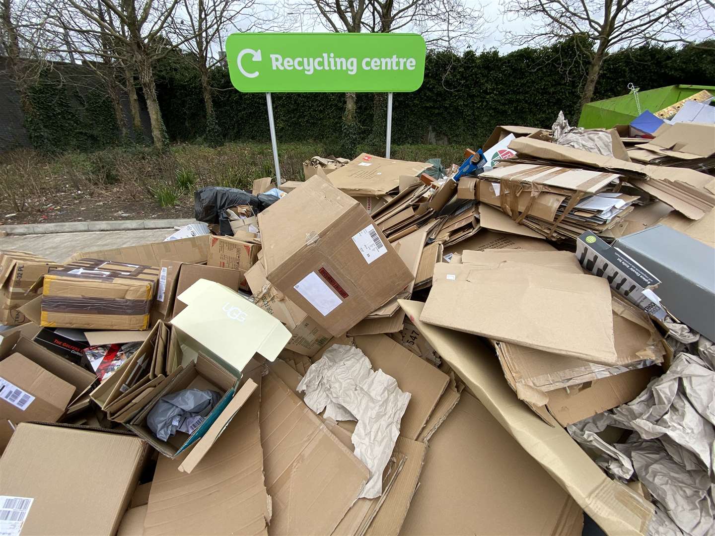 Cardboard boxes in front of a recycling centre sign in a supermarket car park (Martin Keene/PA)
