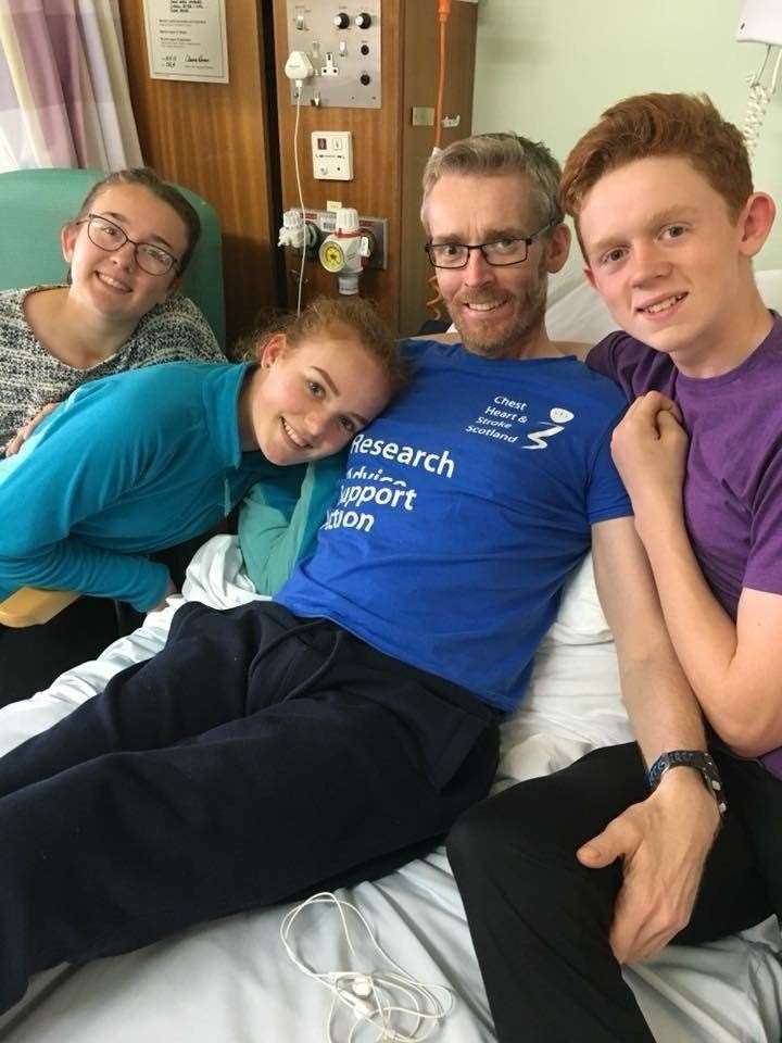Mark Georgeson in ICU with his children.
