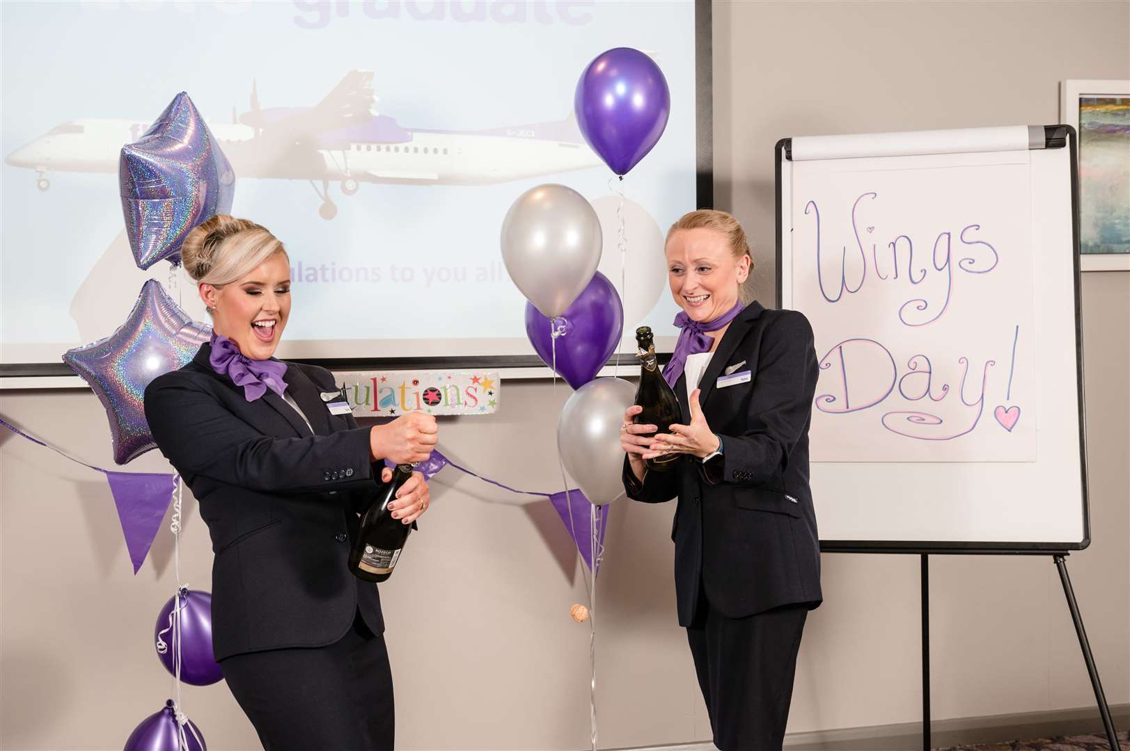 Flybe staff celebrate the launch of the new flights.