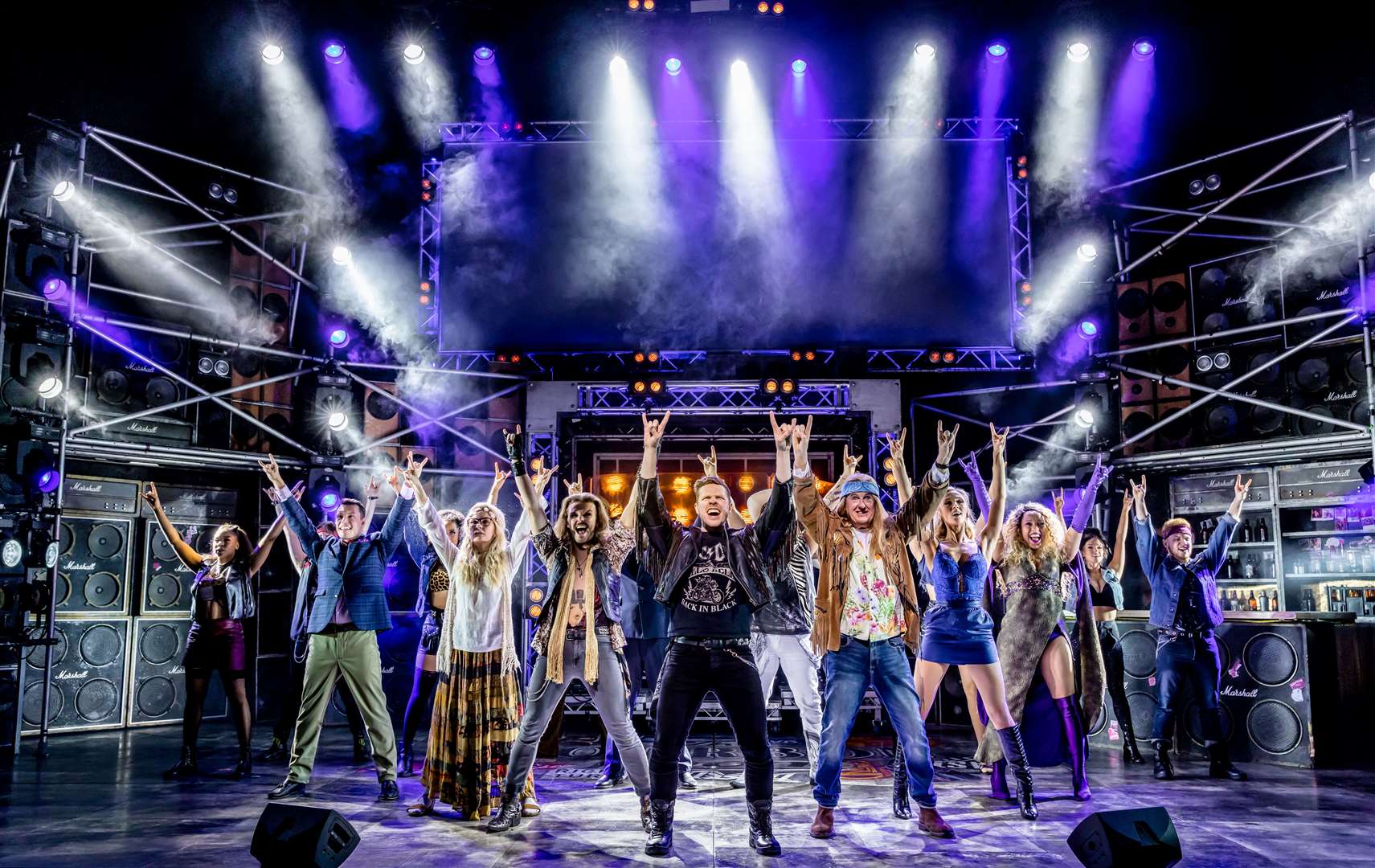 The Rock Of Ages company with Sam Terrell as Drew (centre). Picture: The Other Richard ©The Other Richard