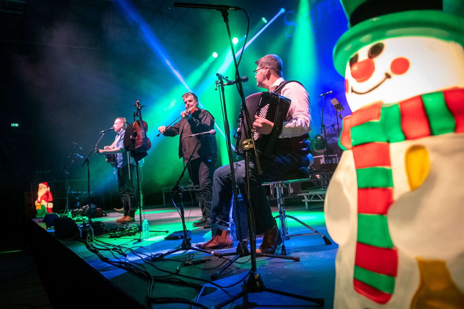 Skipinnish - feeling festive with a snowman and a Santa gracing the stage on the cold December night. Picture: Callum Mackay