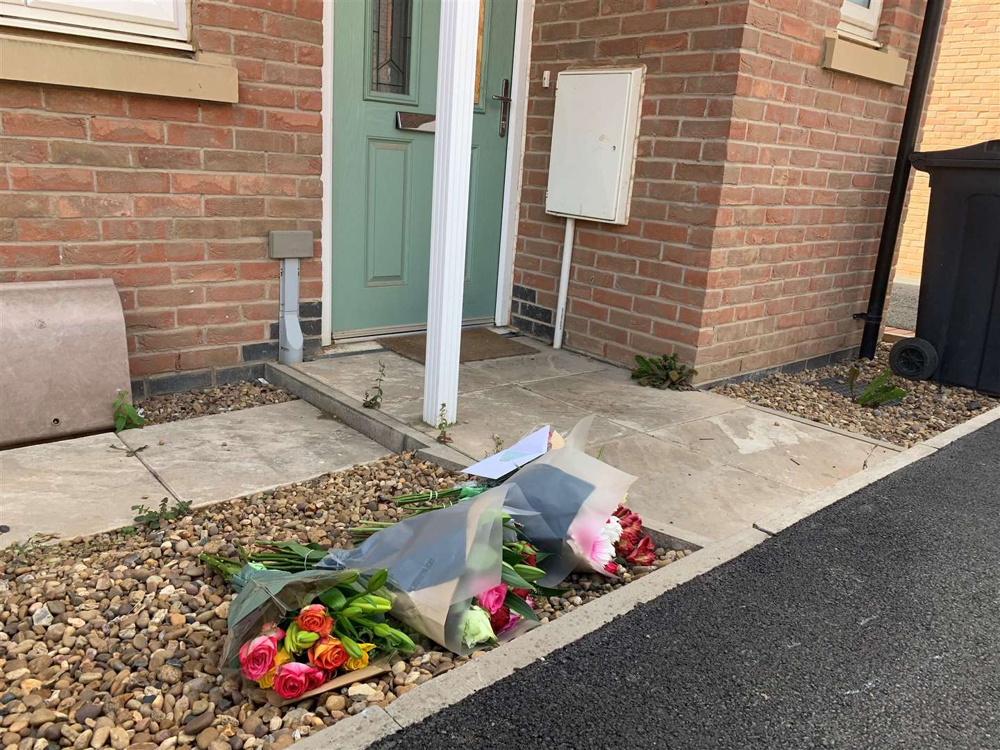 Flowers left outside a property at the scene in Barrow upon Soar (Josh Payne/PA)